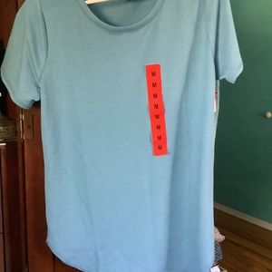Blue woman’s size medium top made by Sketchers